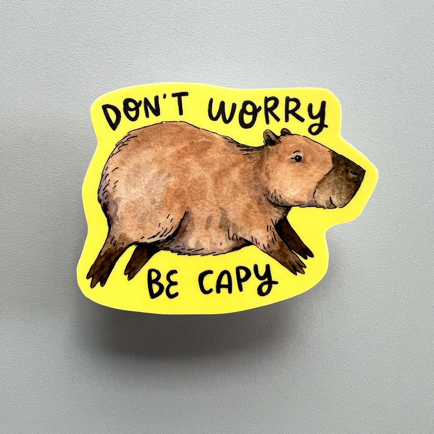 "Don't Worry, Be Capy" Yellow Capybara Sticker