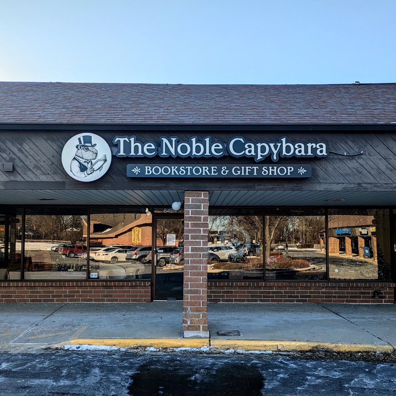 Photograph of the facade of The Noble Capybara brick and mortar bookstore